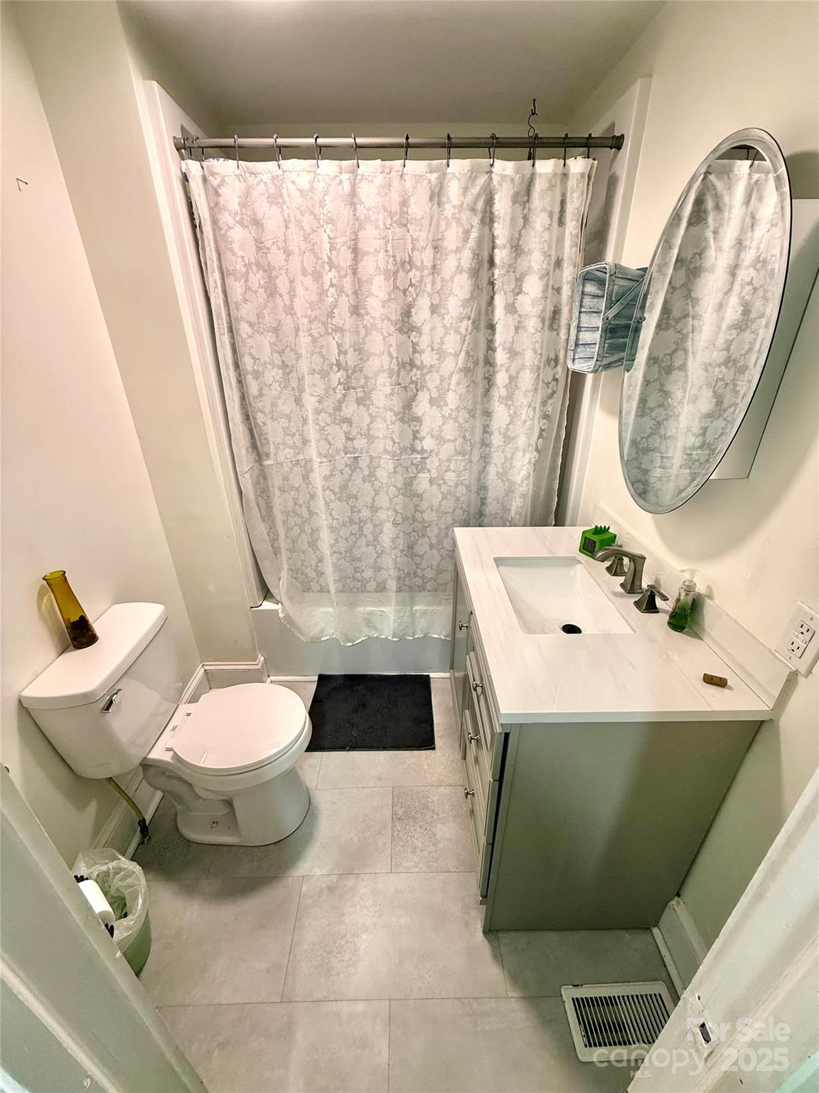 245 Church Street Ellenboro, NC 28040 - Photo 17 of 18 a bathroom with a sink and mirror with toilet