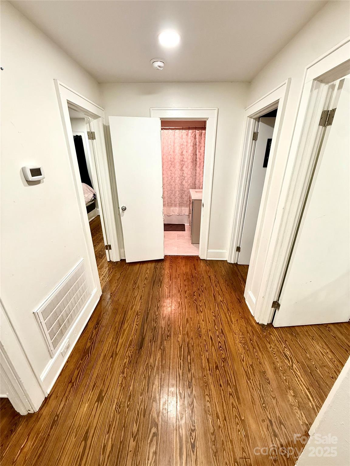 245 Church Street Ellenboro, NC 28040 - Photo 18 of 18 wooden floor with staircase and door