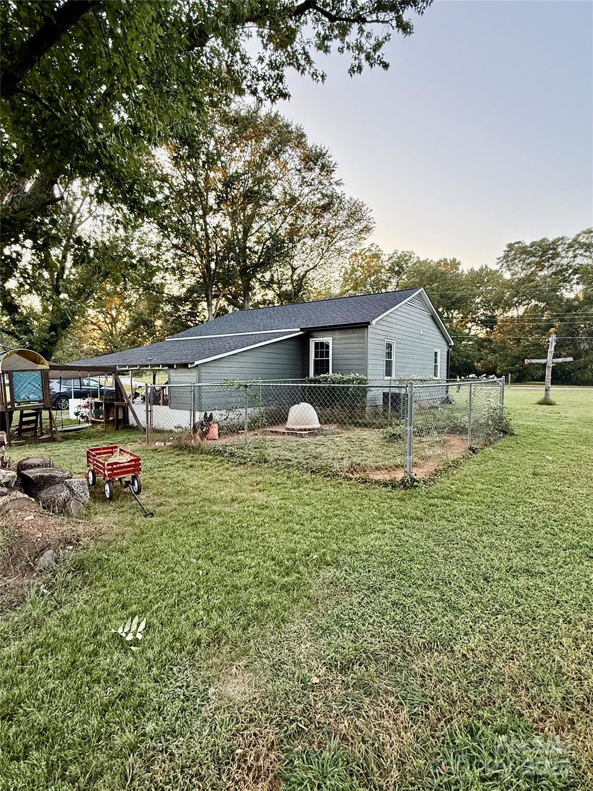 245 Church Street Ellenboro, NC 28040 - Photo 4 of 18 a view of a house with backyard and sitting area