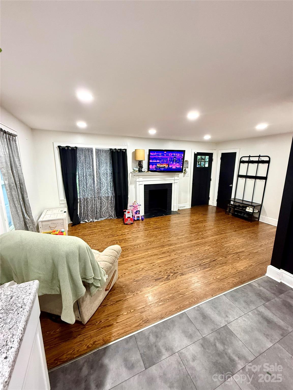 245 Church Street Ellenboro, NC 28040 - Photo 8 of 18 a living room with furniture and a flat screen tv