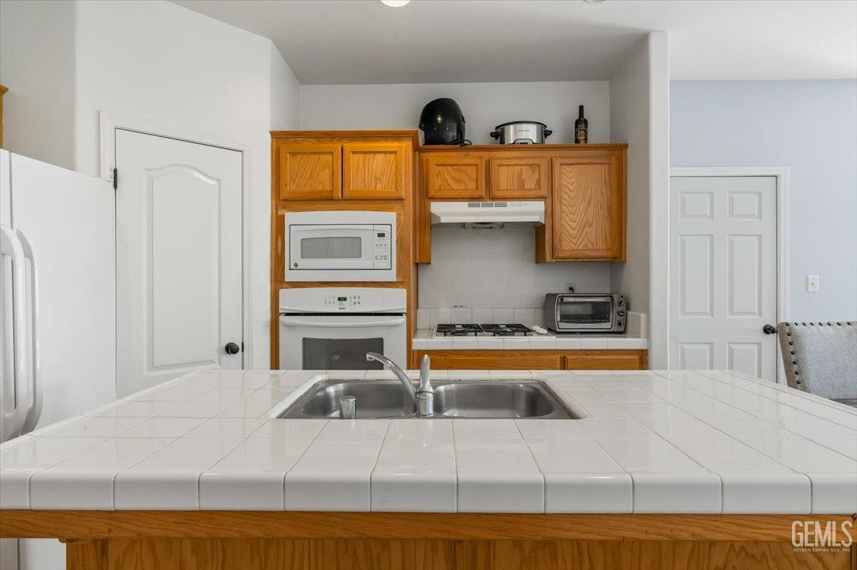 Undisclosed Address Shafter, CA 93263 - Photo 3 of 11 a kitchen with stainless steel appliances granite countertop a sink and cabinets
