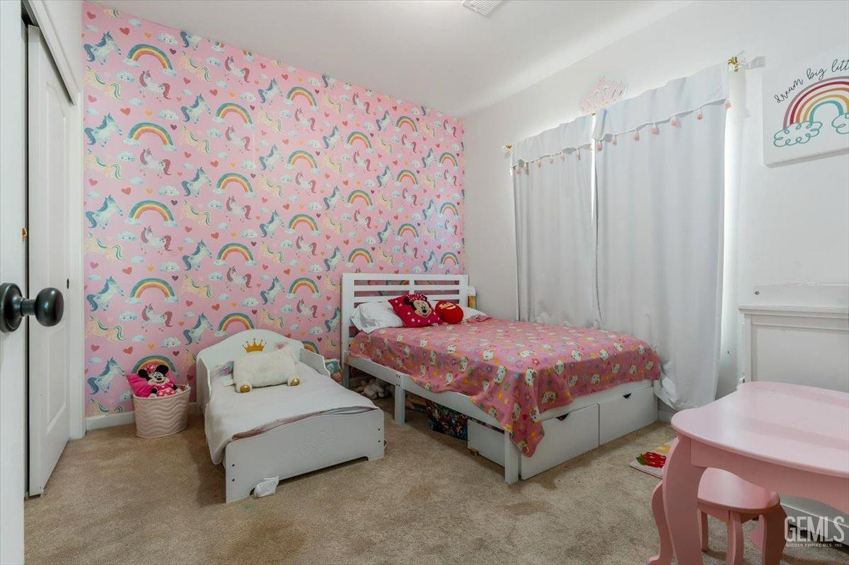 Undisclosed Address Shafter, CA 93263 - Photo 8 of 11 a bedroom with a bed and a dresser