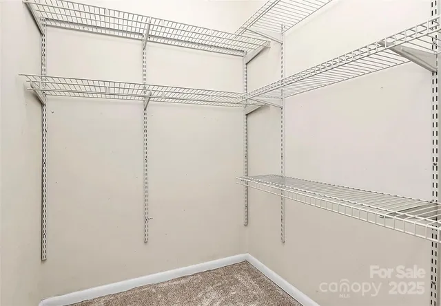 a view of a room with racks on the wall