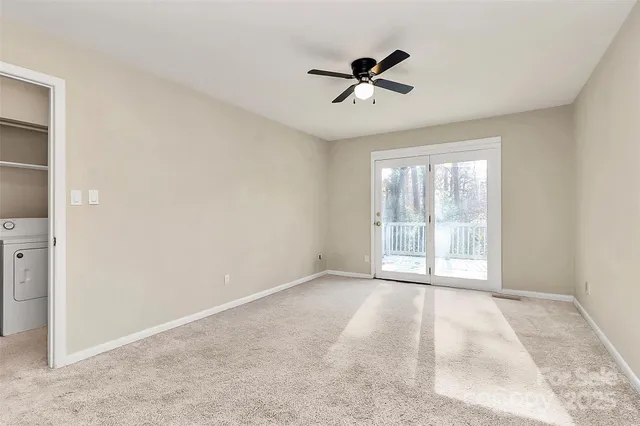 a view of empty room with windows