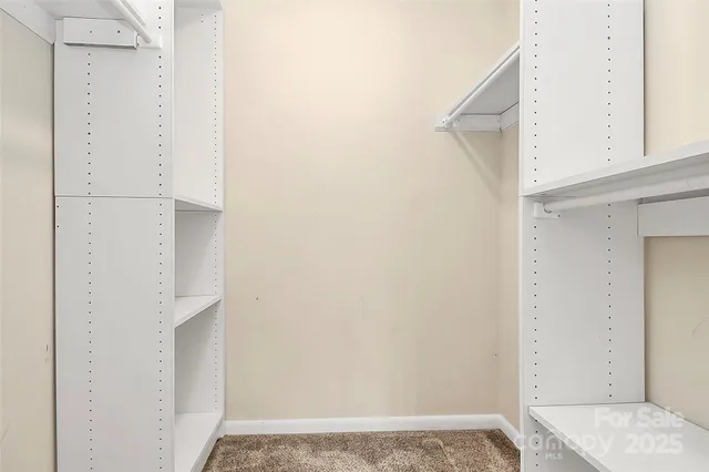 an empty room with a ceiling fan