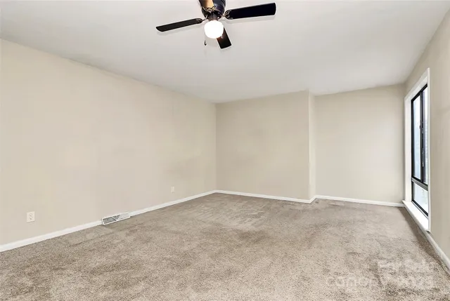 a view of an empty room and window