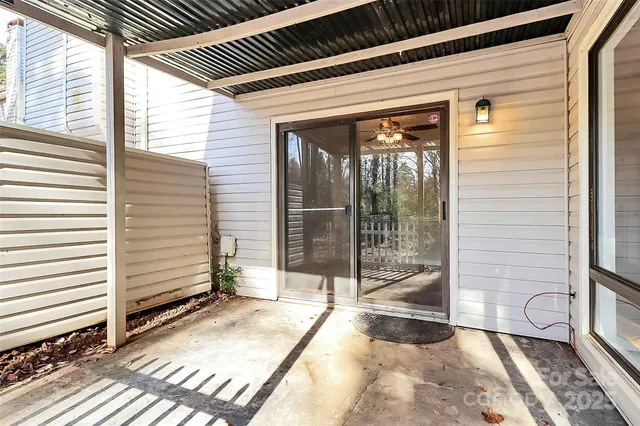 a view of a porch with wooden floor