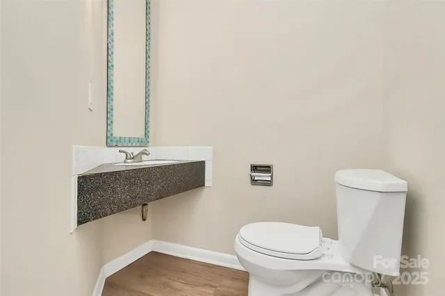 a bathroom with a toilet and a sink