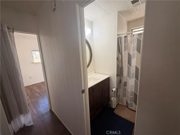 a bathroom with a sink and mirror