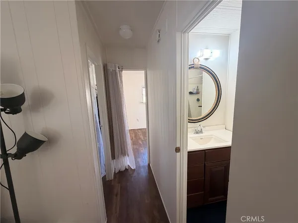 a view of a bathroom with a sink and a mirror
