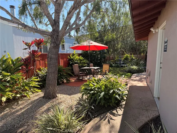 a view of a patio with a table and a chairs