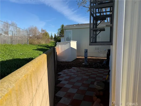 a view of a back yard from a patio