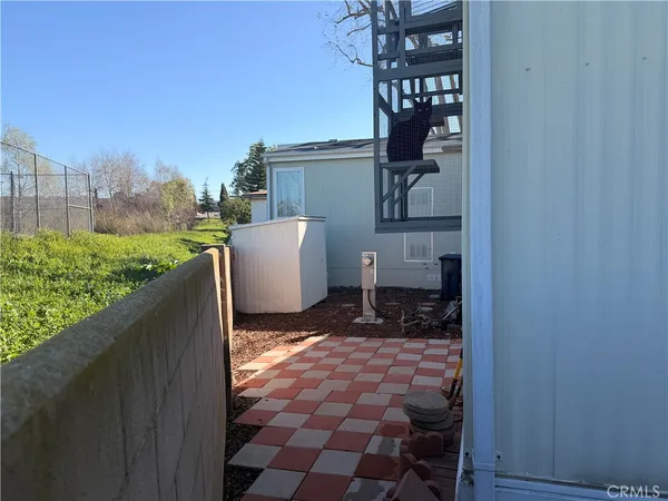 a view of a back yard from a balcony