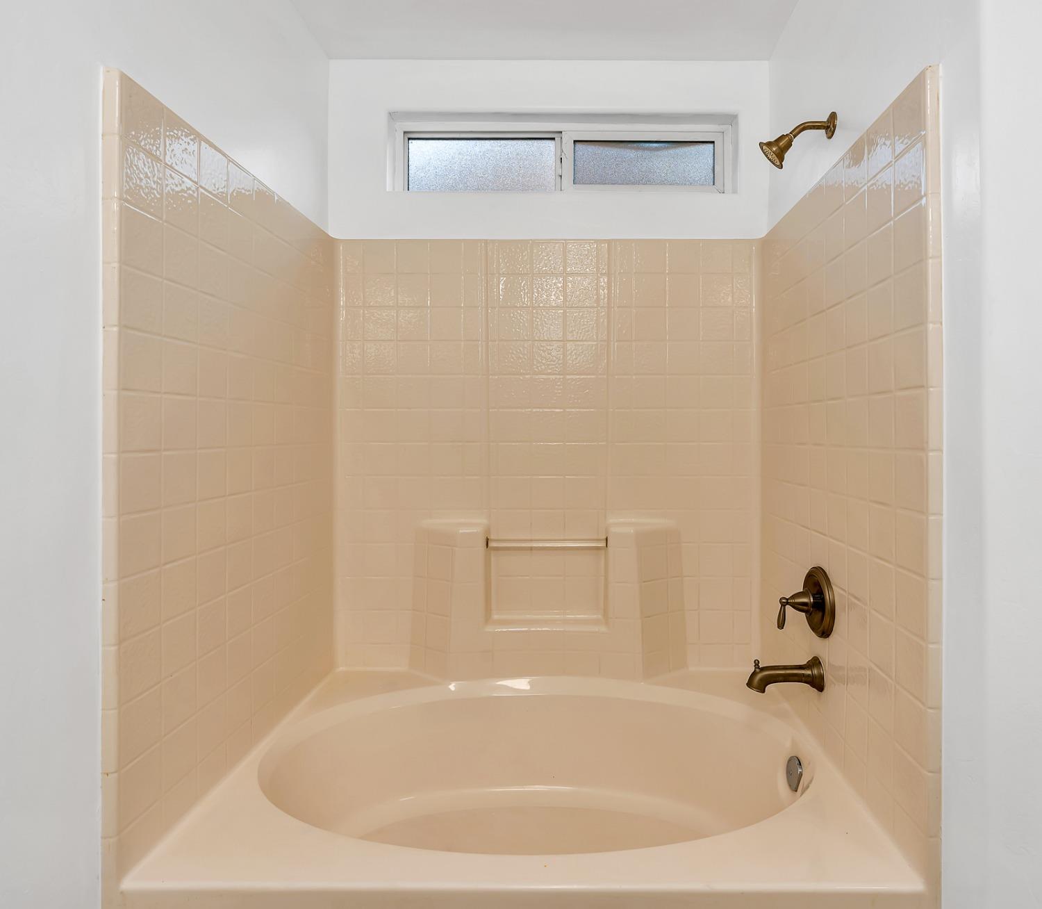 13612 Dromore Court Bakersfield, CA 93314 - Photo 23 of 35 a white bath tub sitting next to a white sink