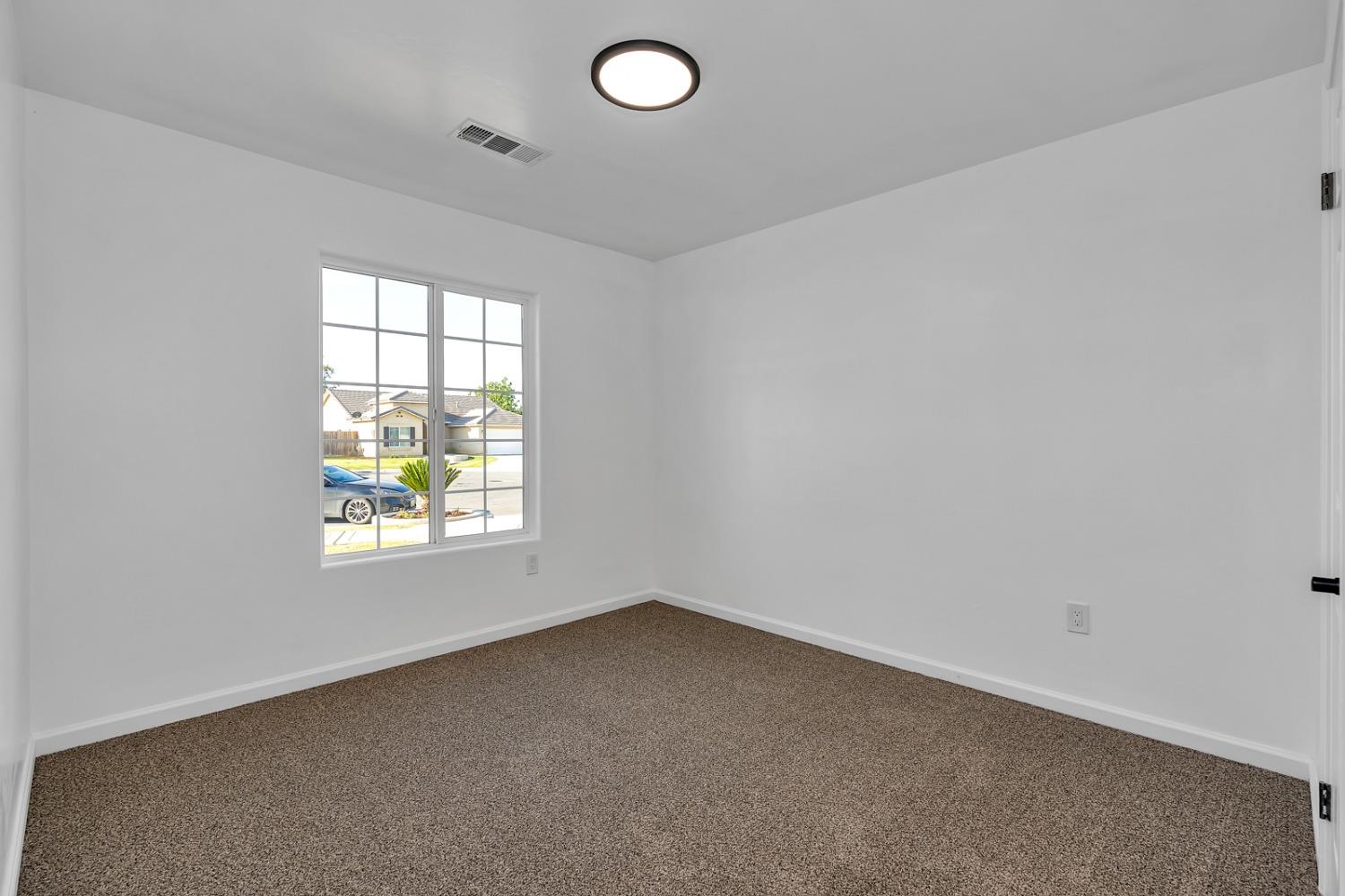 13612 Dromore Court Bakersfield, CA 93314 - Photo 25 of 35 an empty room with windows