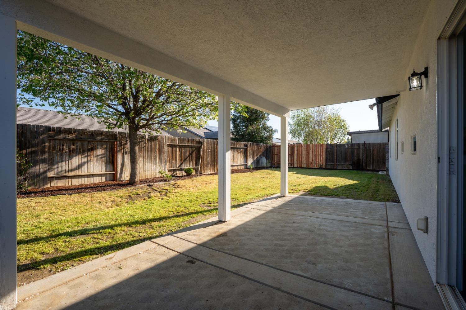13612 Dromore Court Bakersfield, CA 93314 - Photo 29 of 35 a view of a house with a backyard