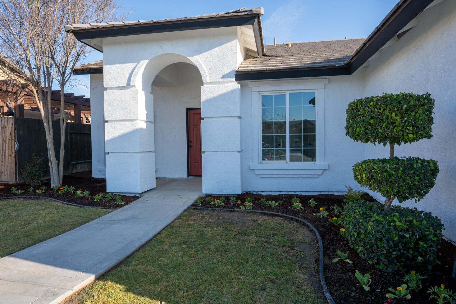 13612 Dromore Court Bakersfield, CA 93314 - Photo 5 of 35 a front view of a house with garden