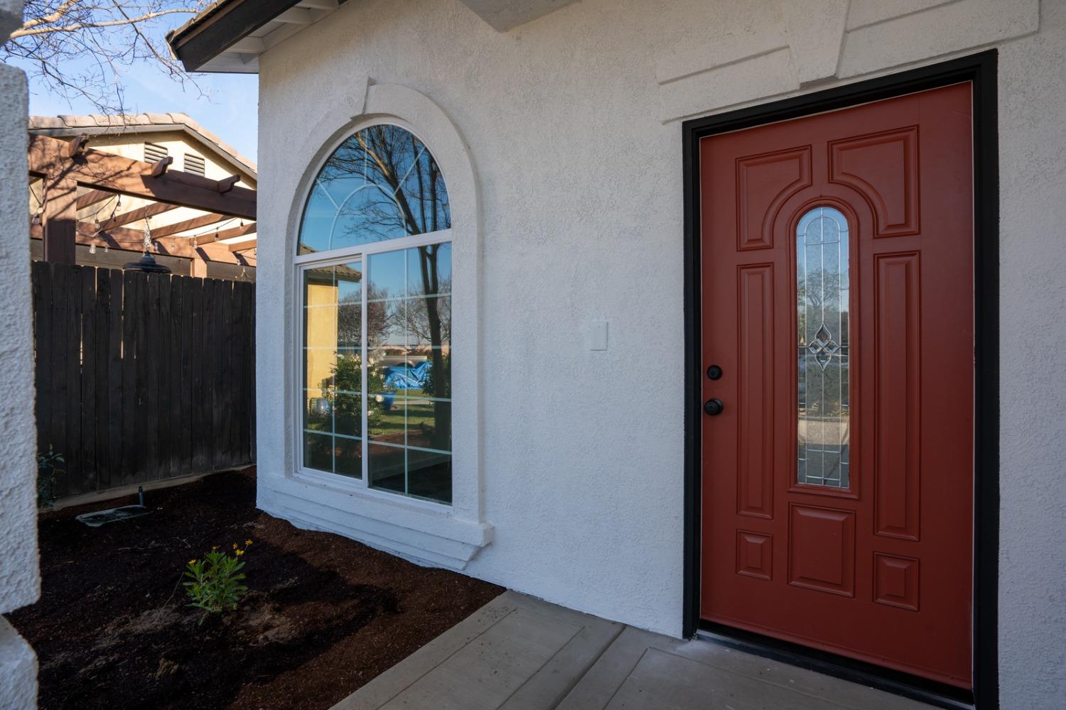 13612 Dromore Court Bakersfield, CA 93314 - Photo 6 of 35 a front view of a house with entryway