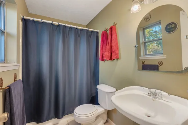 a view of a house with backyard sitting area and garden