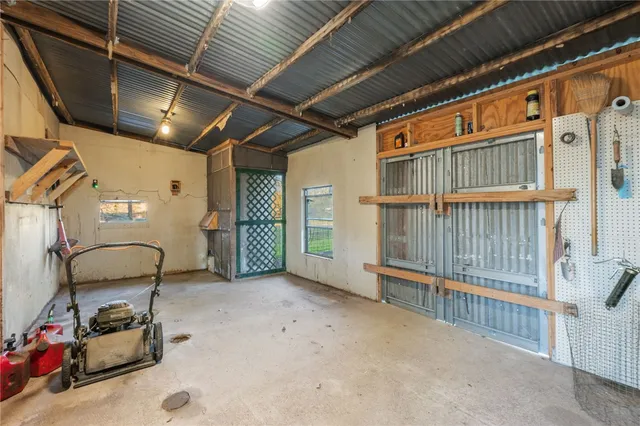 a view of house with backyard and tree