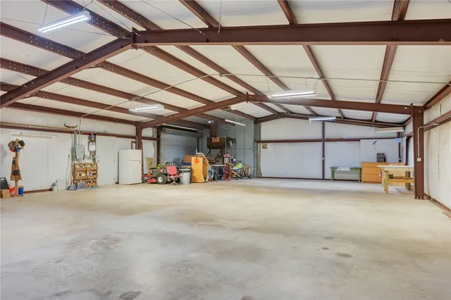 a view of a house with backyard and garden