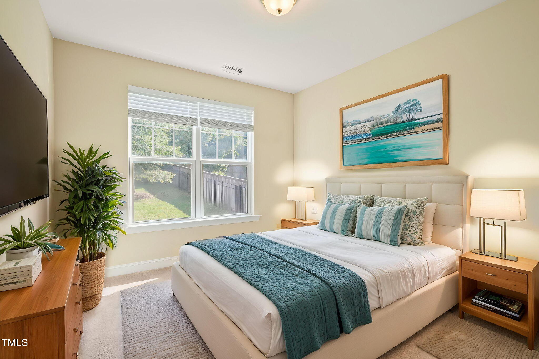 4508 Brintons Cottage Street Raleigh, NC 27616 - Photo 17 of 46 a bedroom with bed and large window