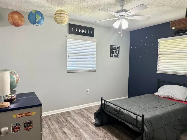 a bedroom with a bed and a table