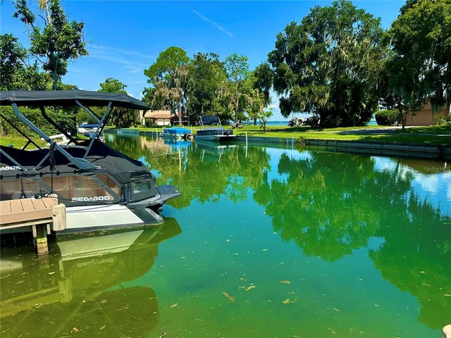 a view of a lake with a house in the background