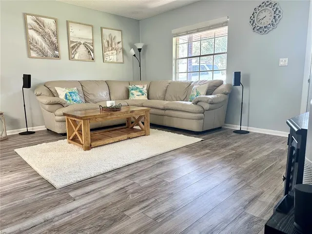 a living room with furniture and a window