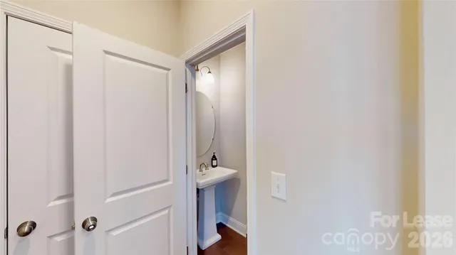 a bathroom with a shower and a sink