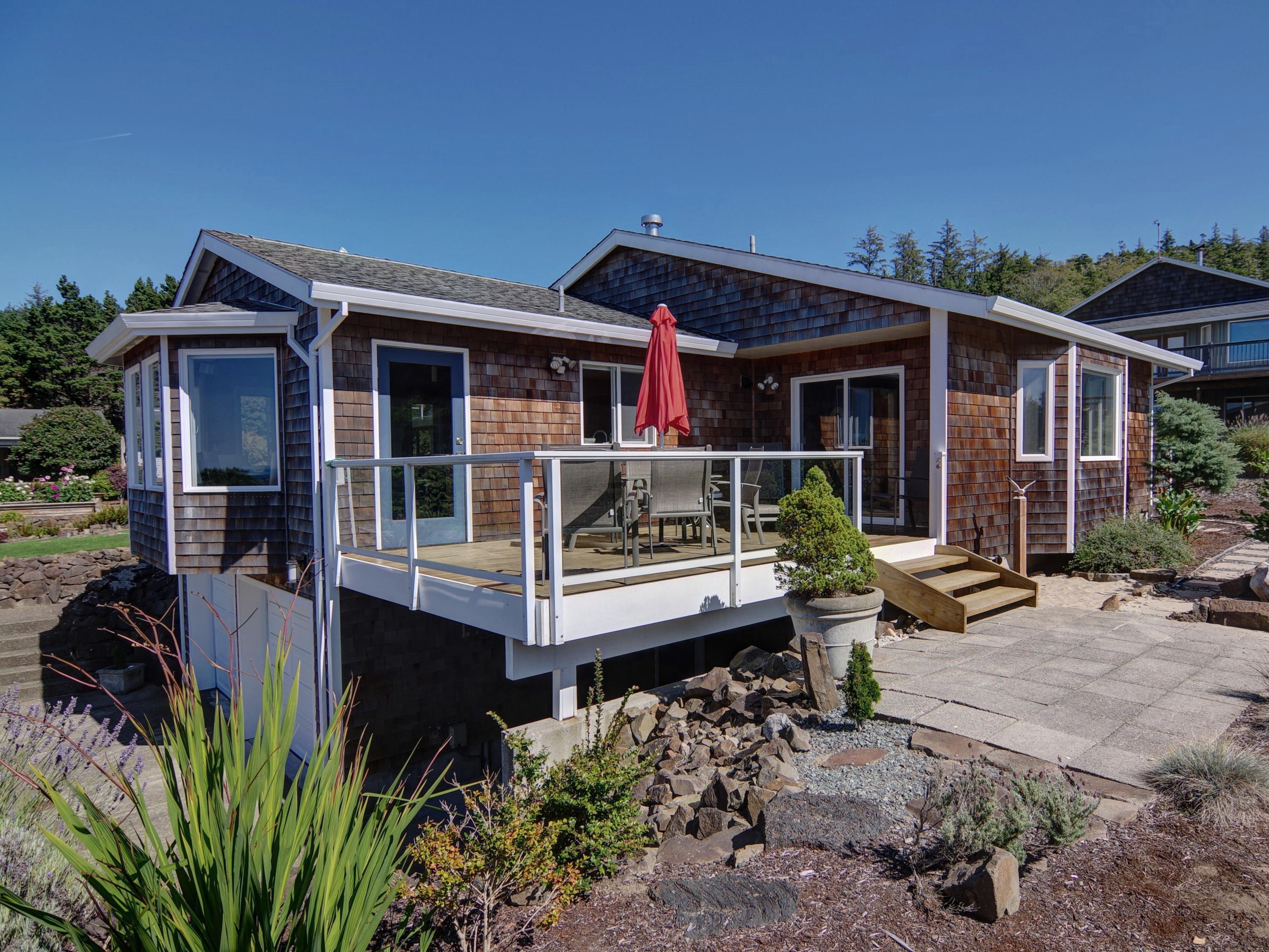 1065 Arthurs Road Oceanside, OR 97141 - Photo 1 of 47 a front view of a house with porch