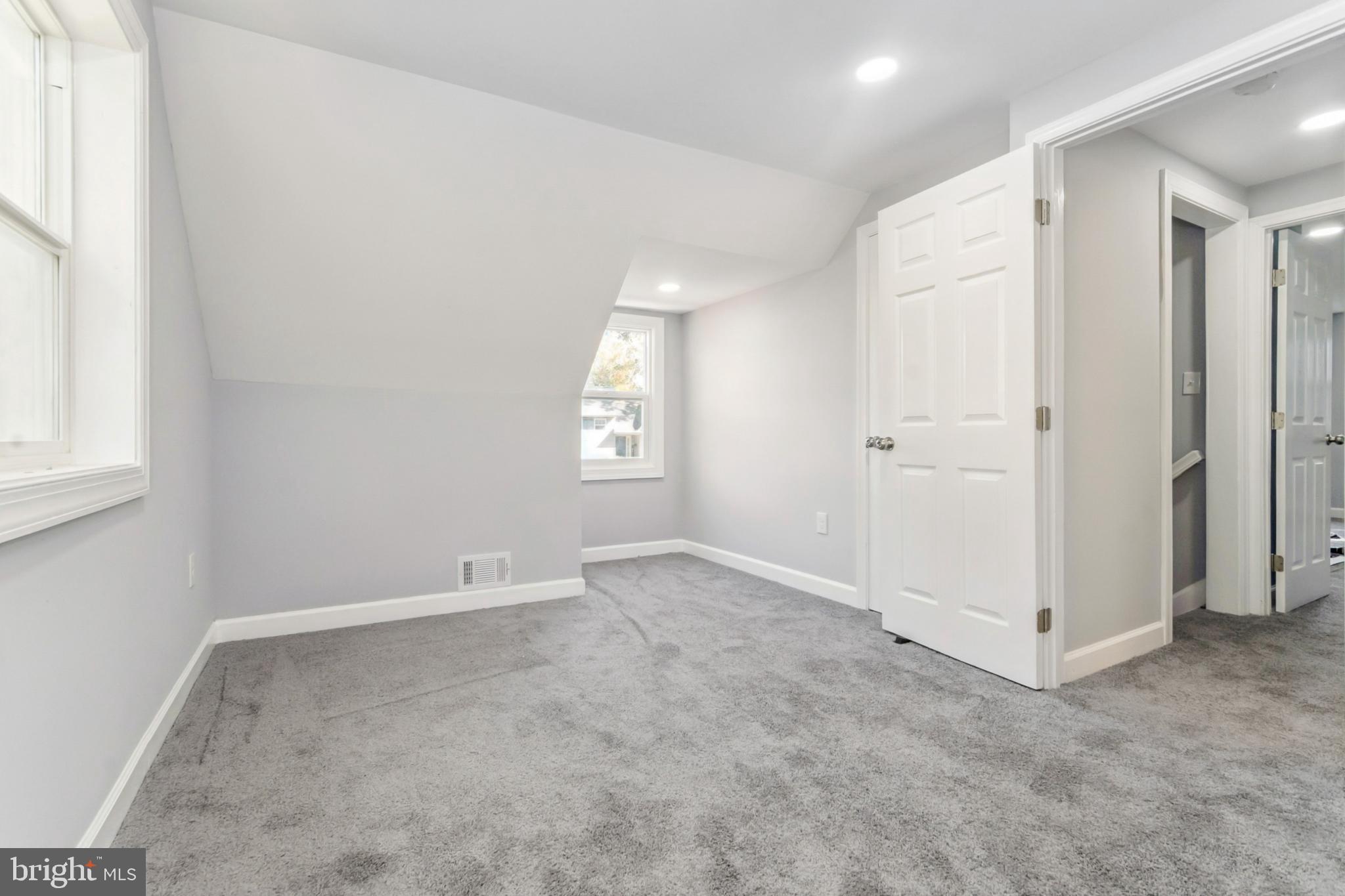 6804 Carol Road Baltimore, MD 21207 - Photo 18 of 25 an empty room with windows and closet