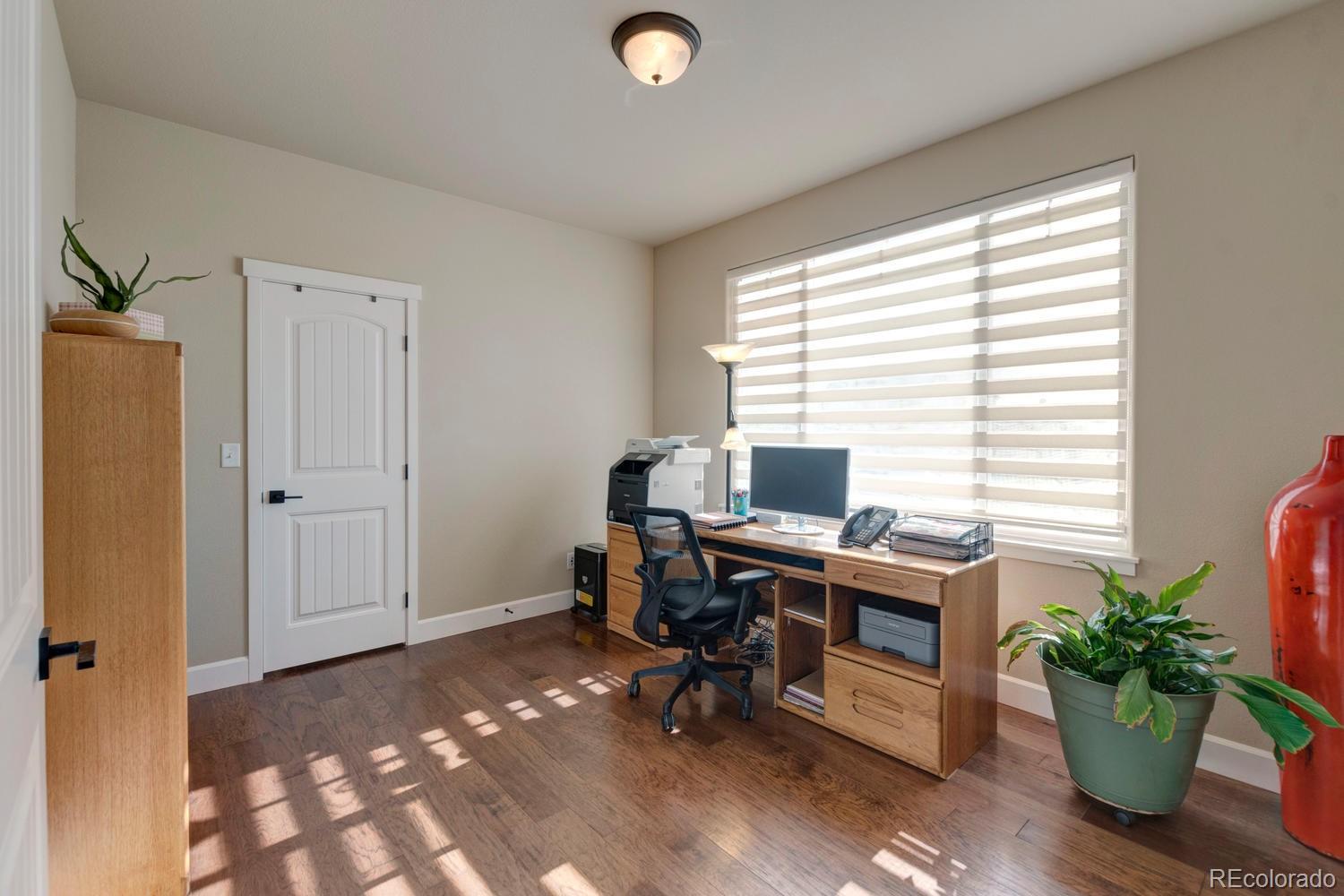 4188 Meadowlark Road Fort Lupton, CO 80621 - Photo 18 of 36 a view of a workspace with furniture and a window
