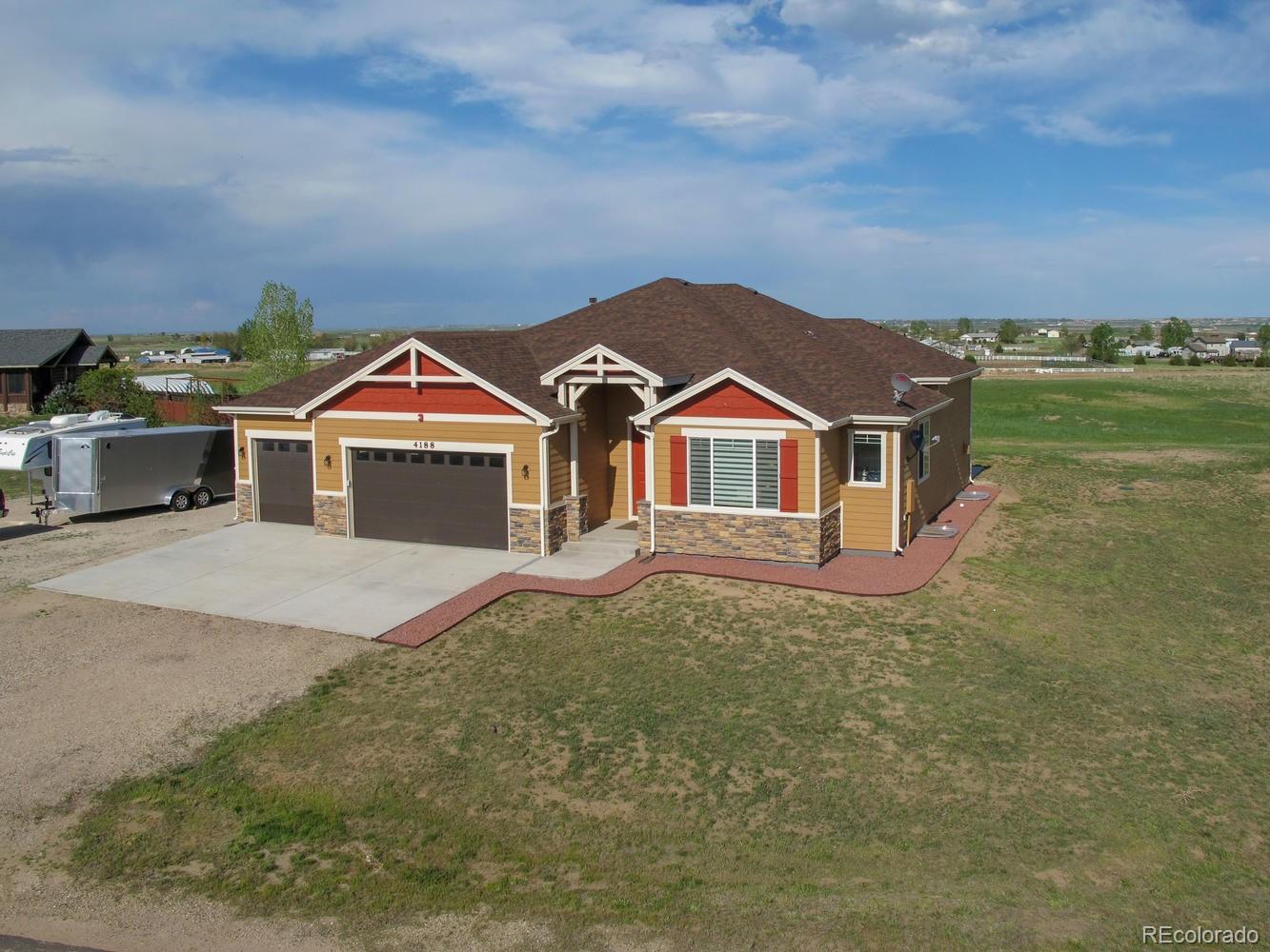 4188 Meadowlark Road Fort Lupton, CO 80621 - Photo 2 of 36 a front view of a house with a yard