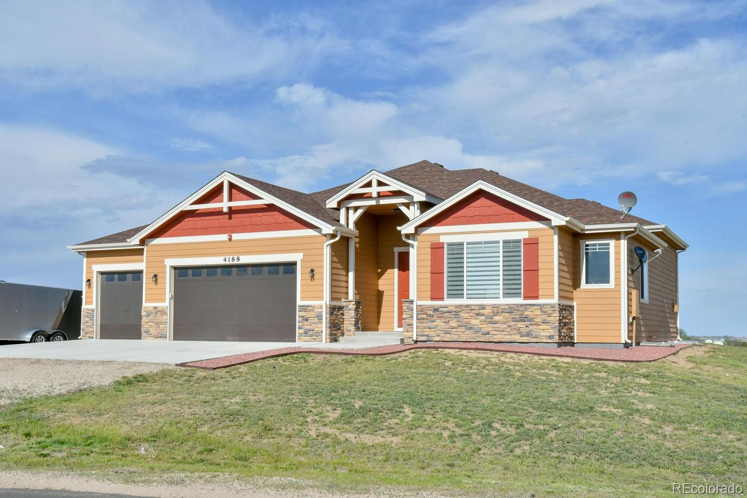 4188 Meadowlark Road Fort Lupton, CO 80621 - Photo 3 of 36 a front view of a house with a yard