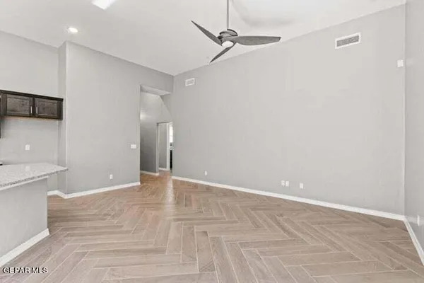a view of an empty room with a bathroom