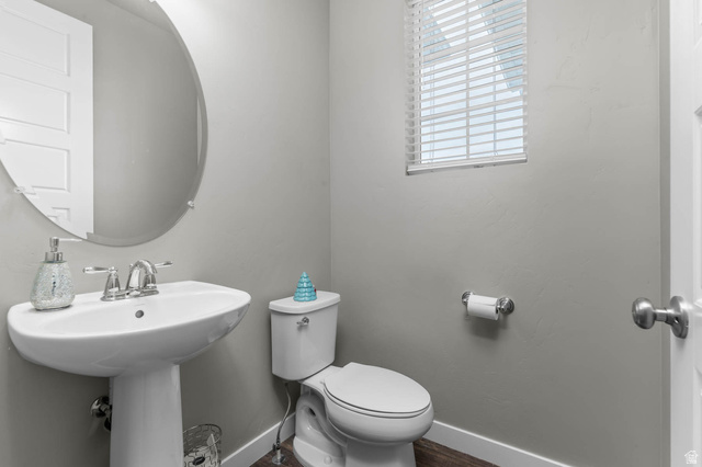 5686 Duke Lane Tooele, UT 84074 - Photo 29 of 38 Bathroom with toilet and dark wood-style floors