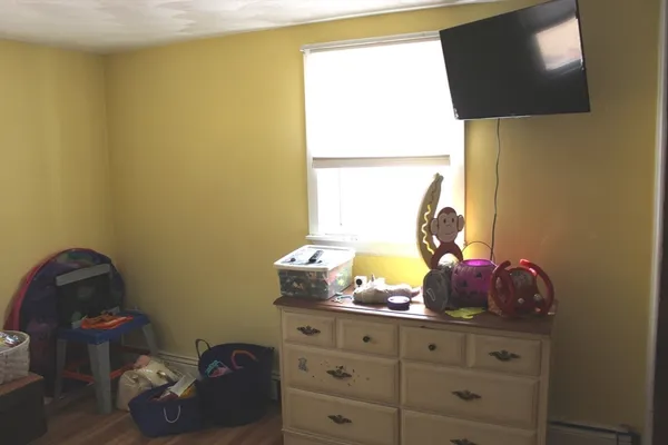 a room with toys and wooden floor