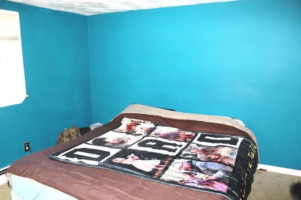 a bedroom with a bed