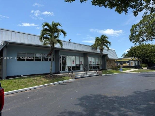 5331 Southwest 35th Street Davie, FL 33314 - Photo 30 of 31 a view of a house with a patio and a yard