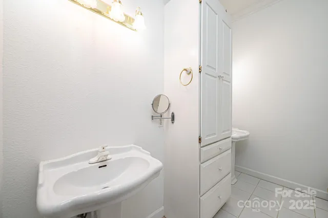 a bathroom with a sink and mirror