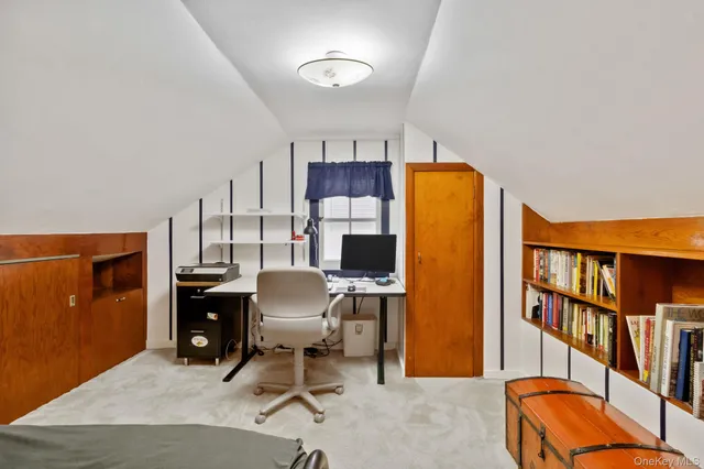 a workspace with furniture and a bookshelf