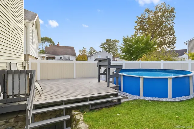 a view of a chairs and table in a backyard