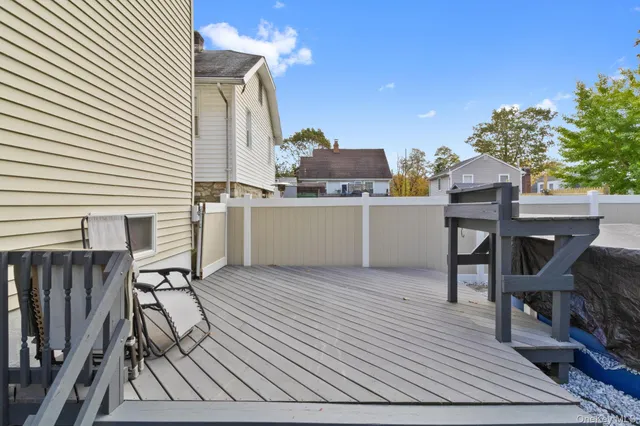 a view of a chairs and table in the balcony