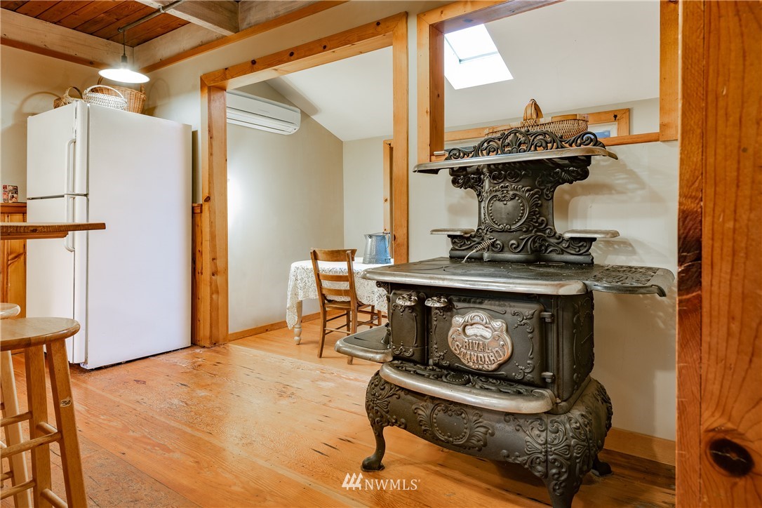 5044 South Pass Road Sumas, WA 98295 - Photo 14 of 34 a living room with furniture and a fireplace