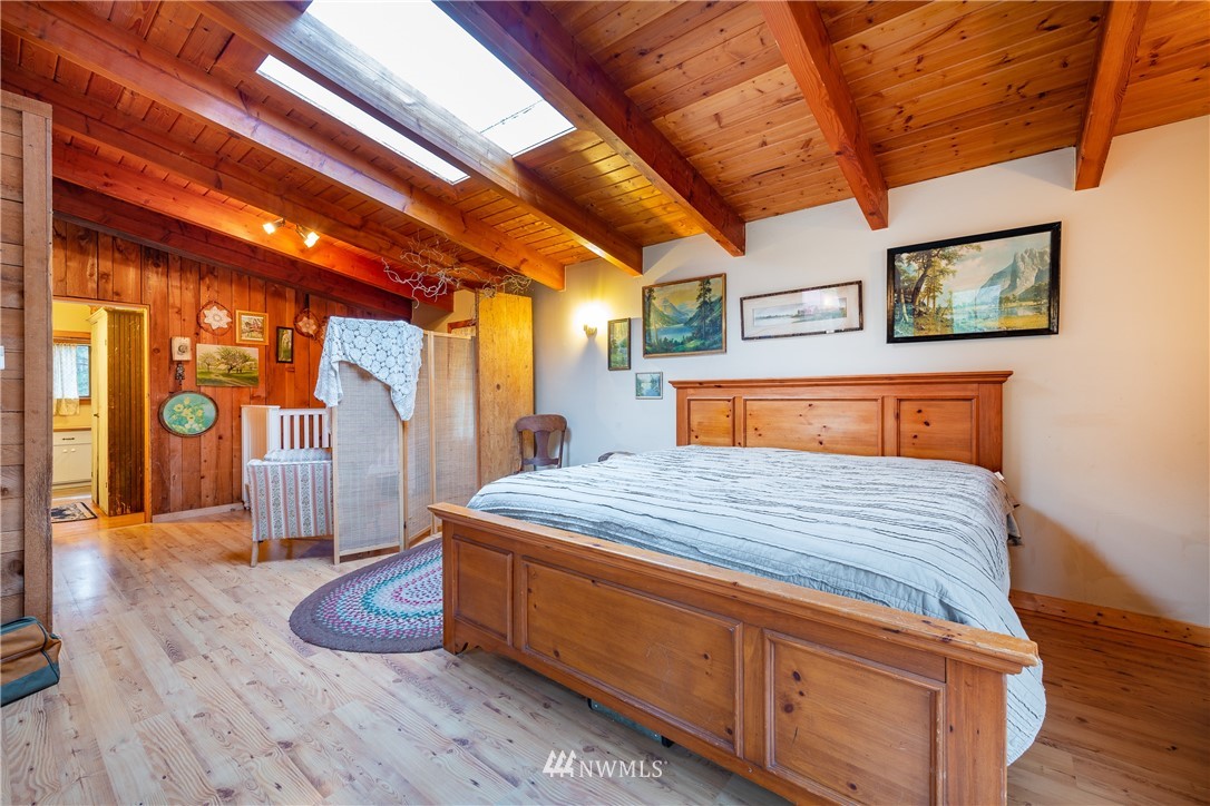 5044 South Pass Road Sumas, WA 98295 - Photo 22 of 34 a bedroom with bed and wooden floor