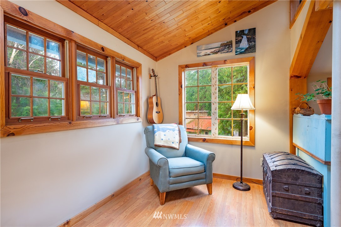 5044 South Pass Road Sumas, WA 98295 - Photo 8 of 34 a living room with furniture a flat screen tv and large windows