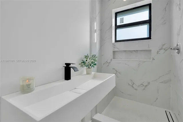 a bathroom with a sink and a bathtub