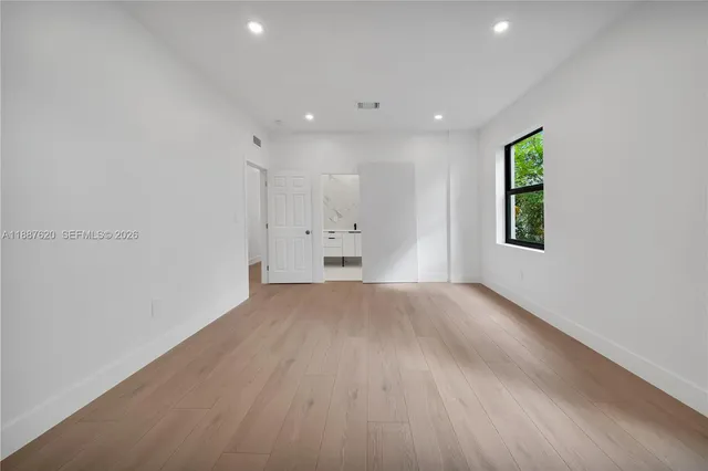 a view of an empty room and window