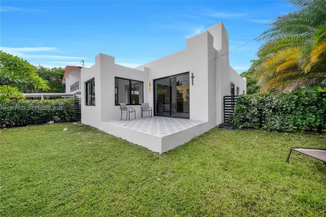 a view of a backyard with a garden and plants